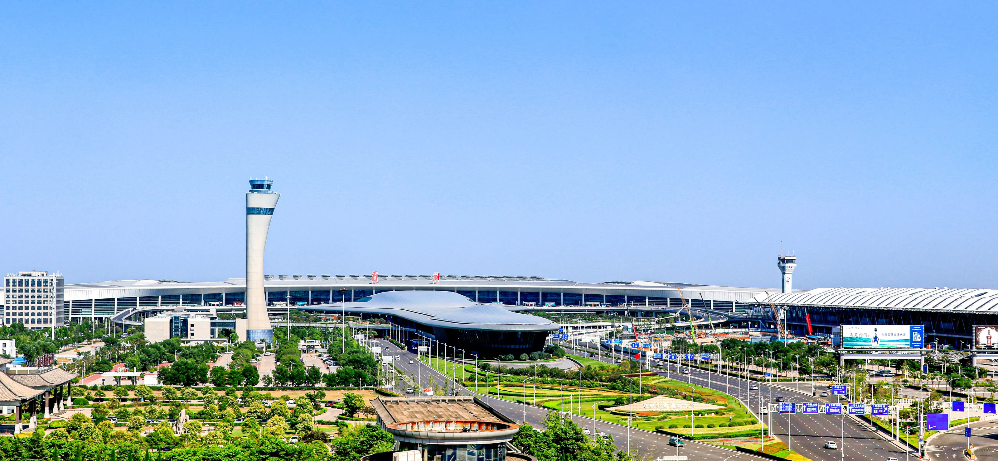 Zhengzhou Airport Economy Zone aerotropolis, the airport, cargo terminals and the modern aviation city skyline of central China